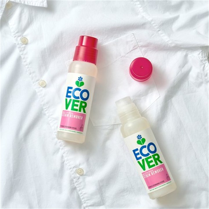 Ecover stain remover bottles laid on a white shirt